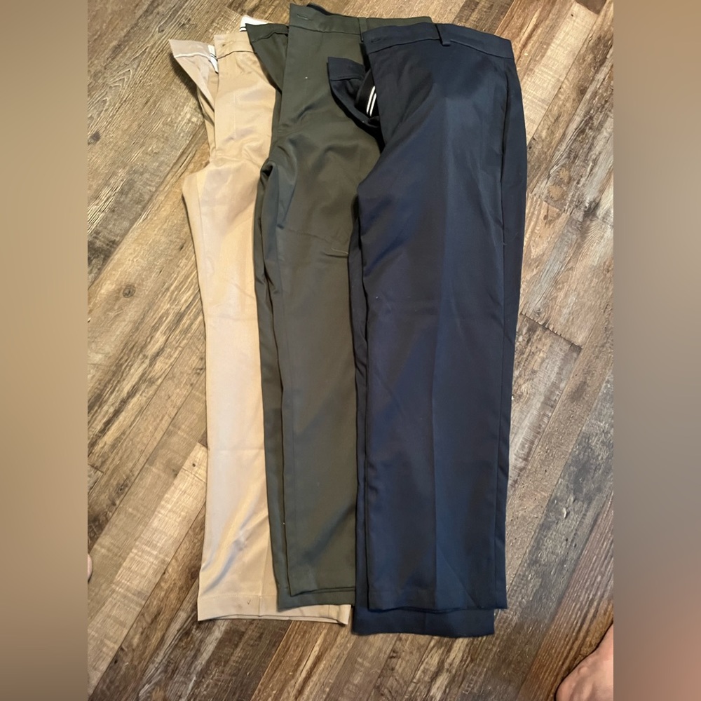 Three pairs of  flat front dress pants. Size 42.